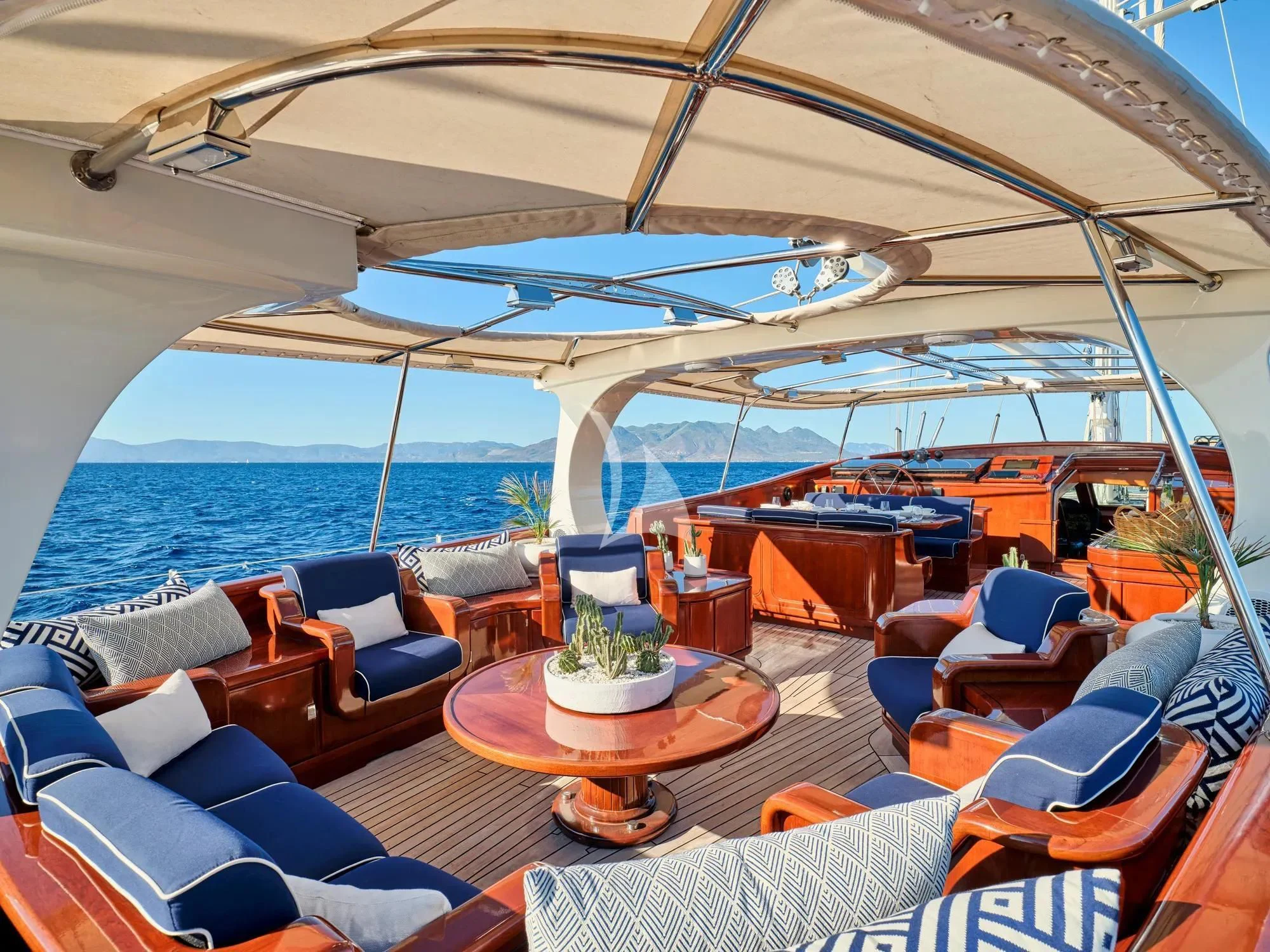 a boat with a table and chairs aboard GITANA Yacht for Charter