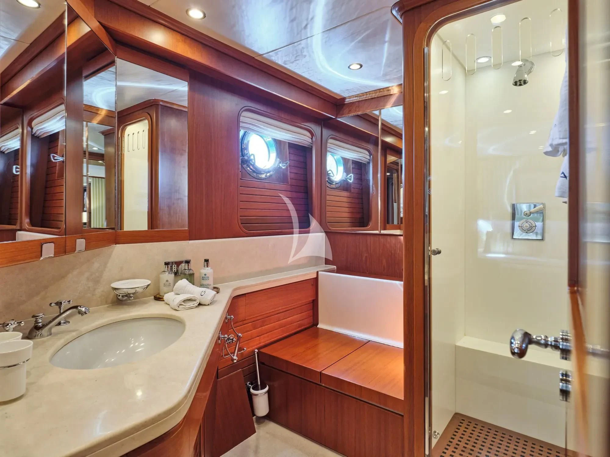 a bathroom with a sink and a bathtub aboard GITANA Yacht for Charter