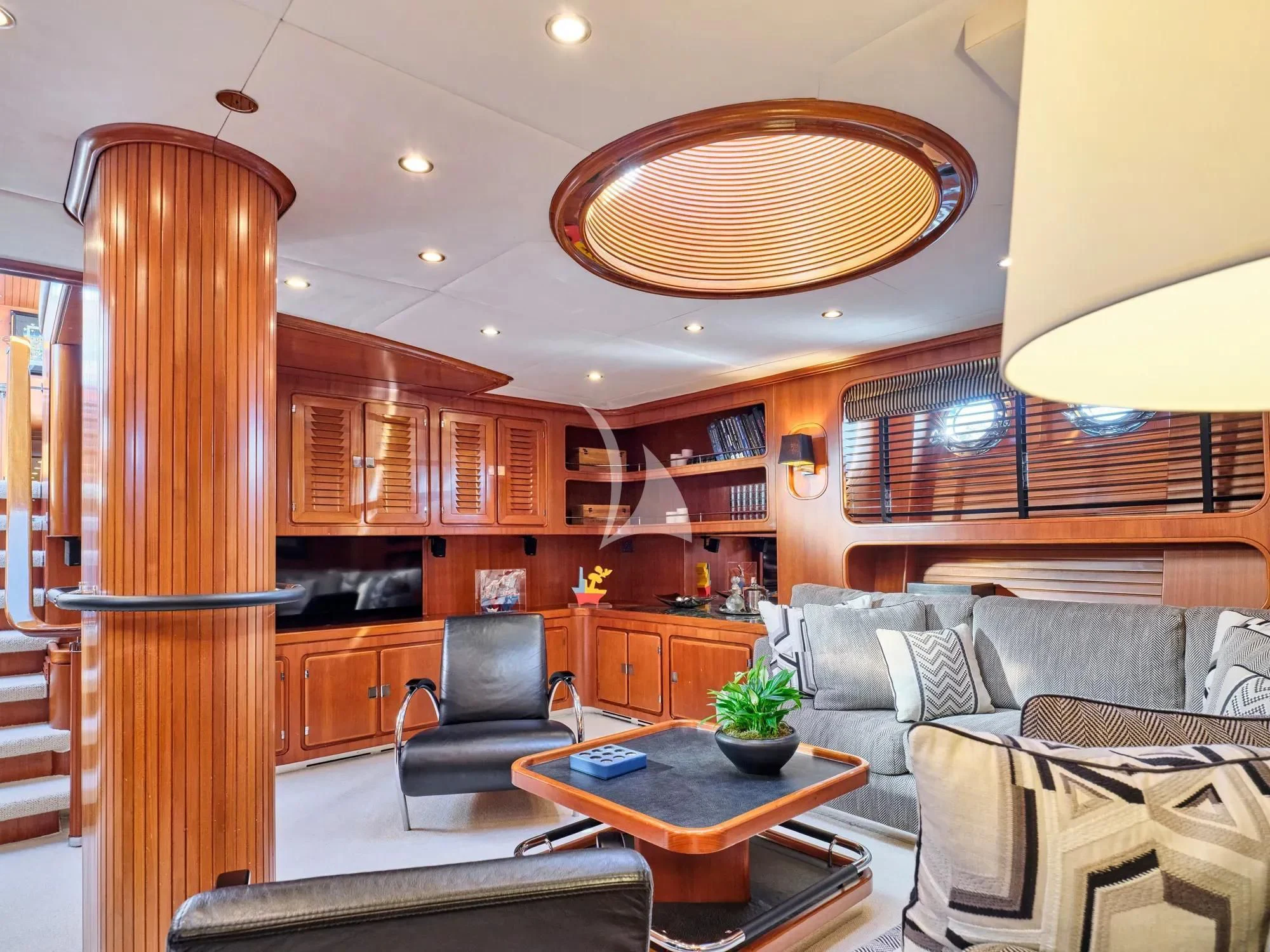 a living room with a couch and a table aboard GITANA Yacht for Charter