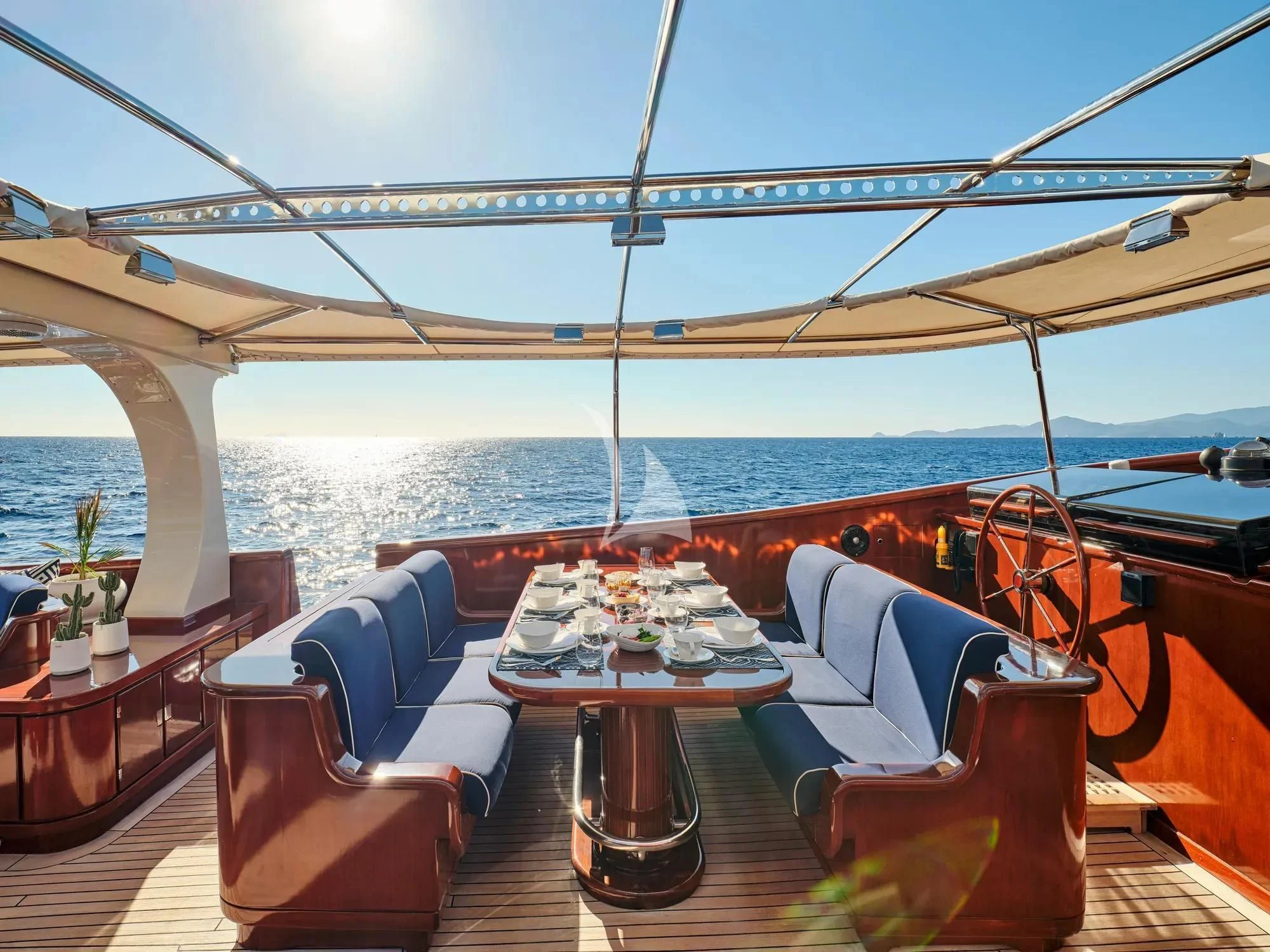 a table on a boat aboard GITANA Yacht for Charter