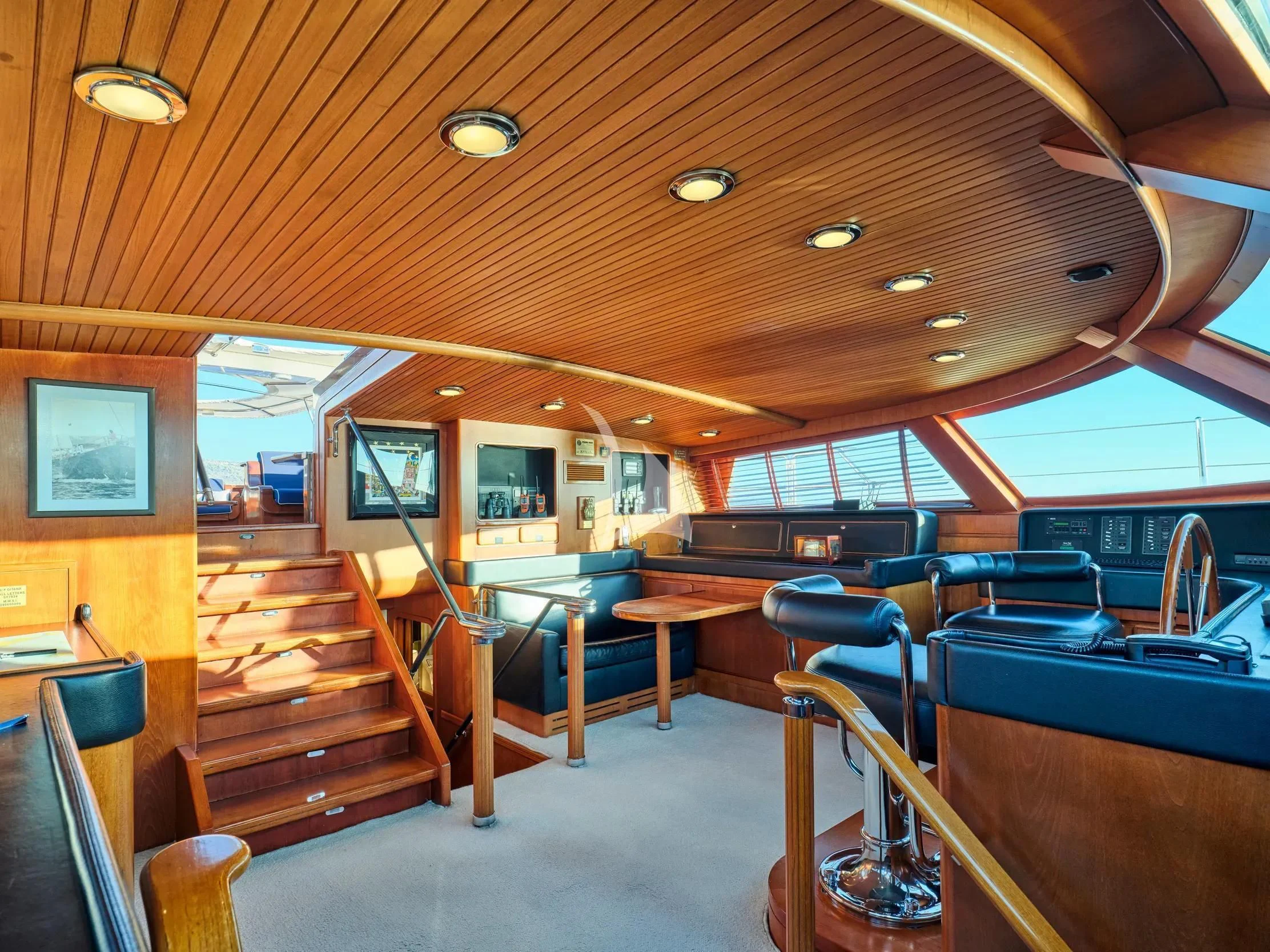 inside of a building with wooden benches aboard GITANA Yacht for Charter