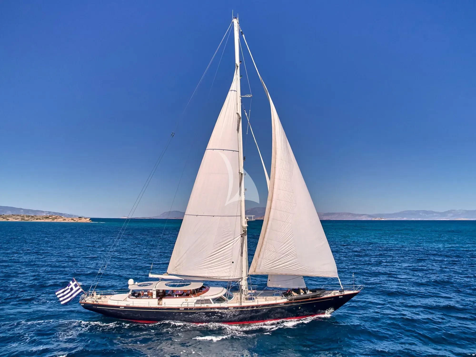 a sailboat in the water aboard GITANA Yacht for Charter