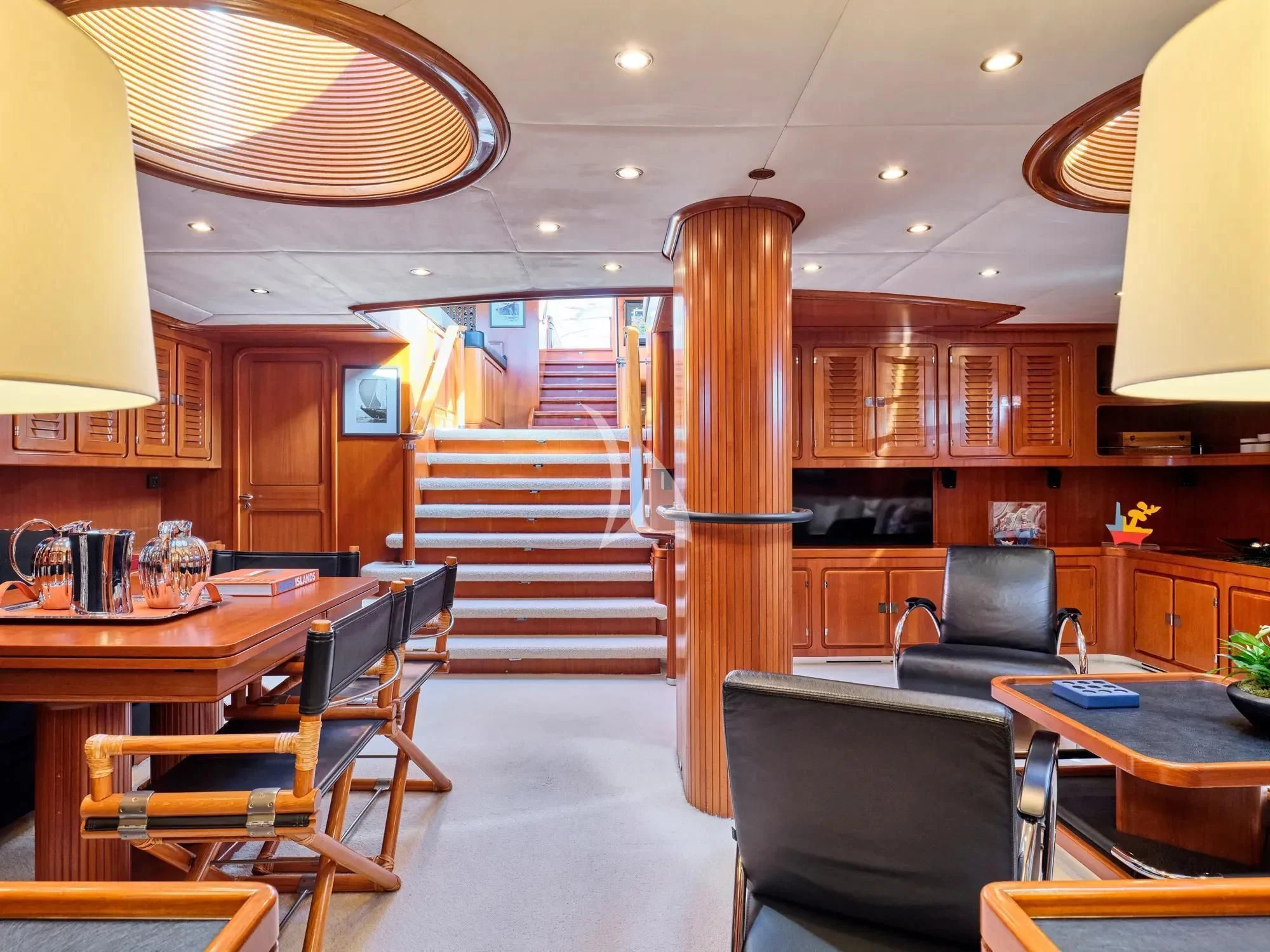 a kitchen with wooden cabinets aboard GITANA Yacht for Charter