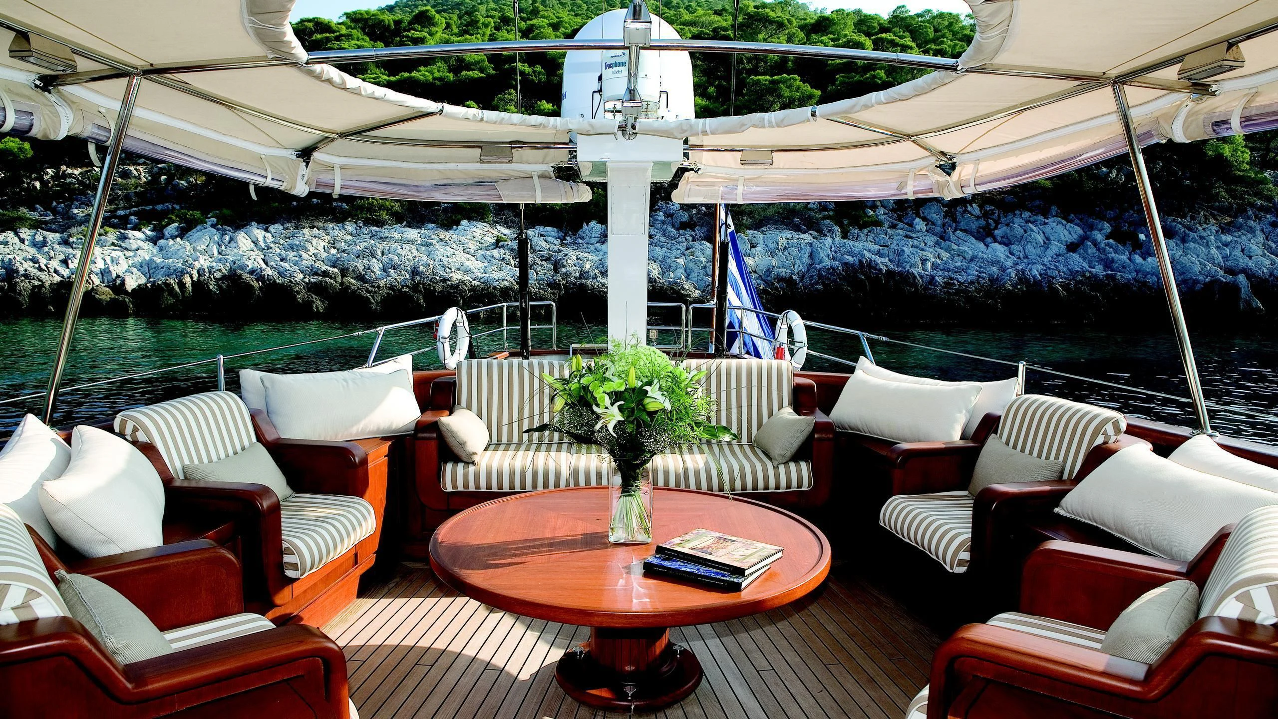 a room with a table and chairs aboard GITANA Yacht for Charter