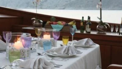 a table with many glasses and food on it aboard GITANA Yacht for Charter