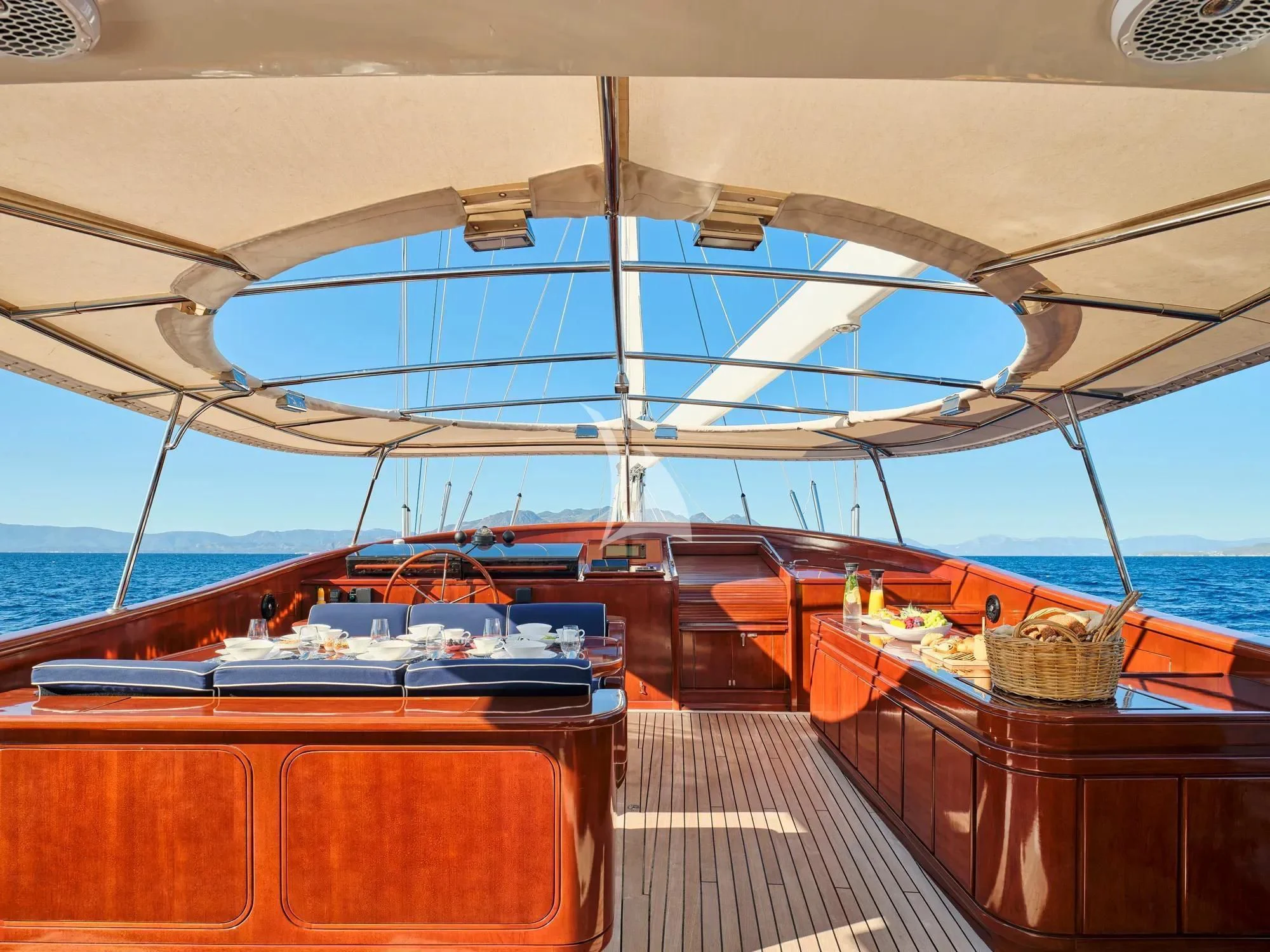 a boat on a deck aboard GITANA Yacht for Charter