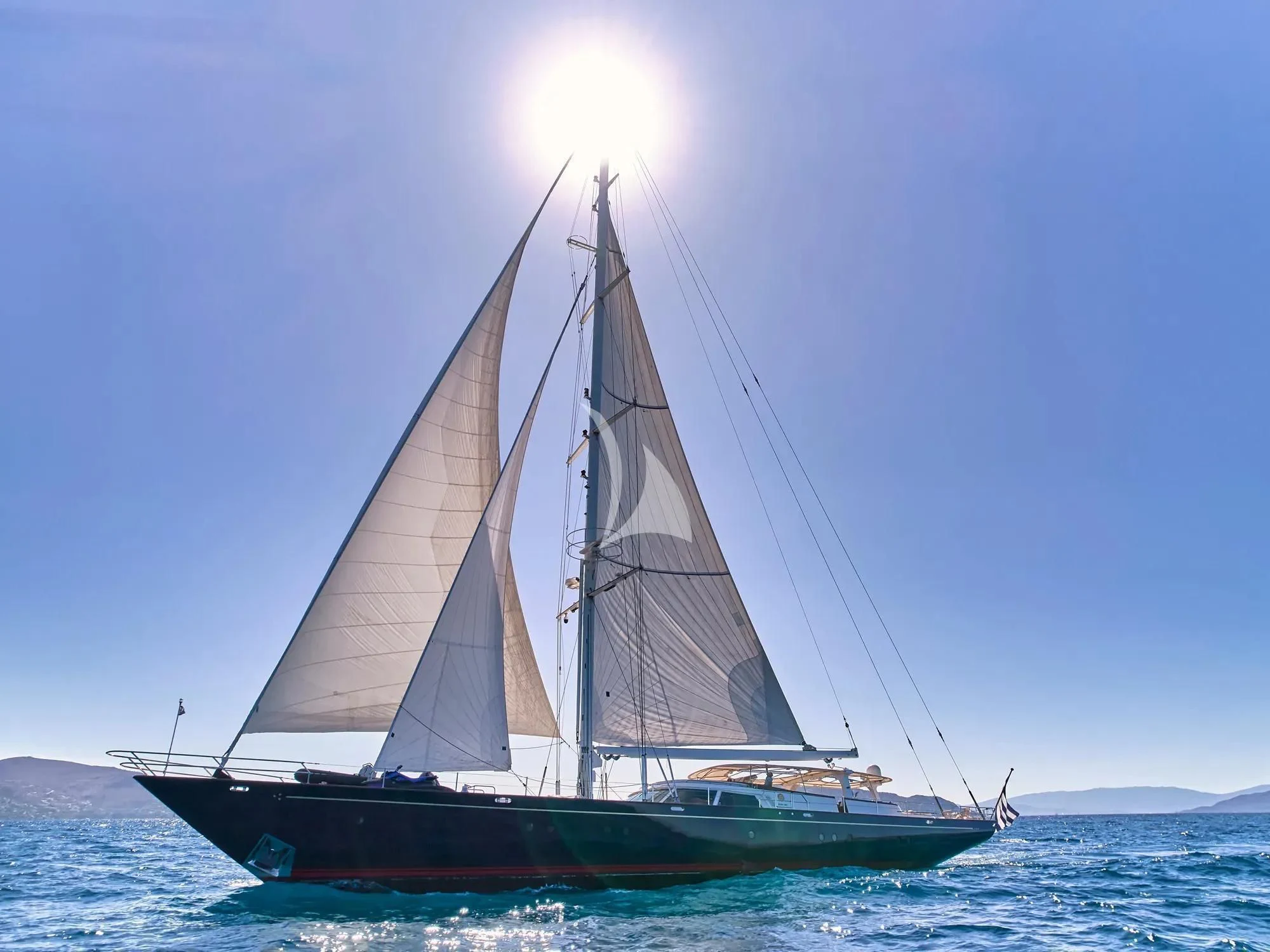 a sailboat in the water aboard GITANA Yacht for Charter
