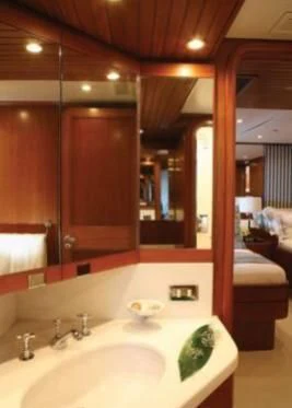 a bathroom with a sink and a mirror aboard GITANA Yacht for Charter