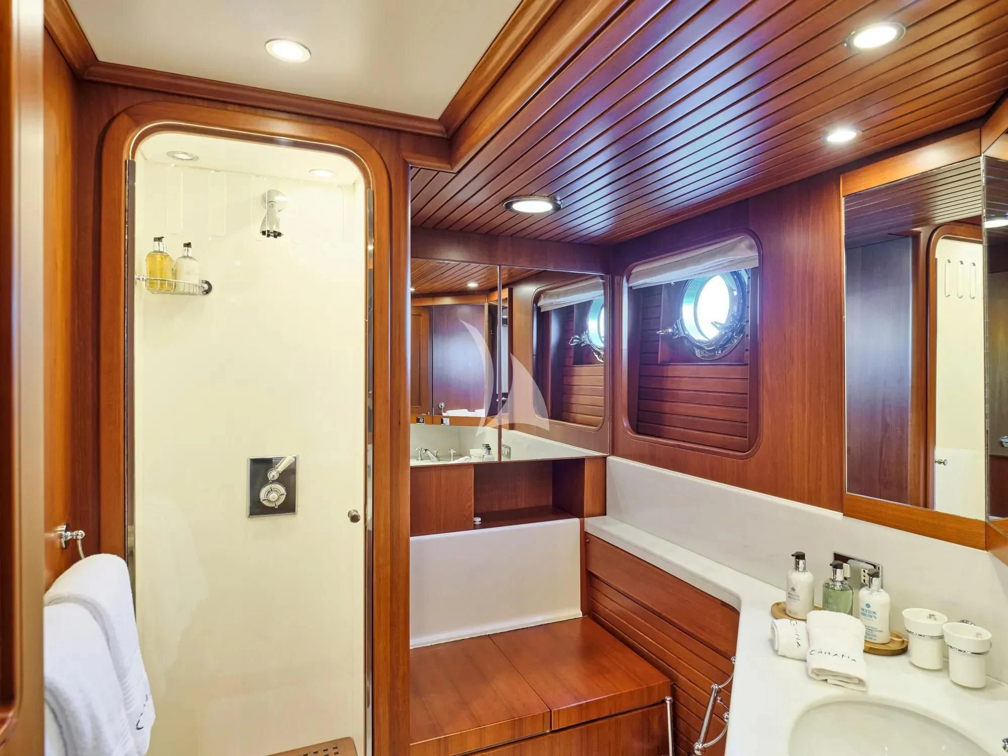 a bathroom with a large mirror aboard GITANA Yacht for Charter