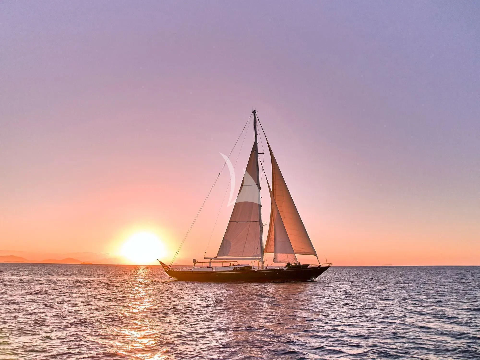 a sailboat in the water aboard GITANA Yacht for Charter