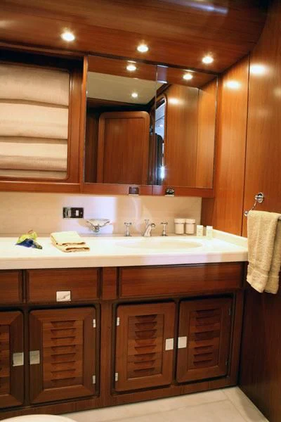 a kitchen with wooden cabinets aboard GITANA Yacht for Charter