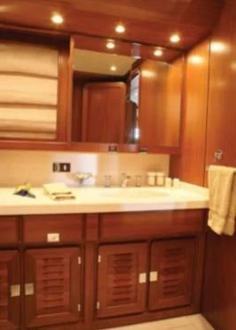 a kitchen with wooden cabinets aboard GITANA Yacht for Charter