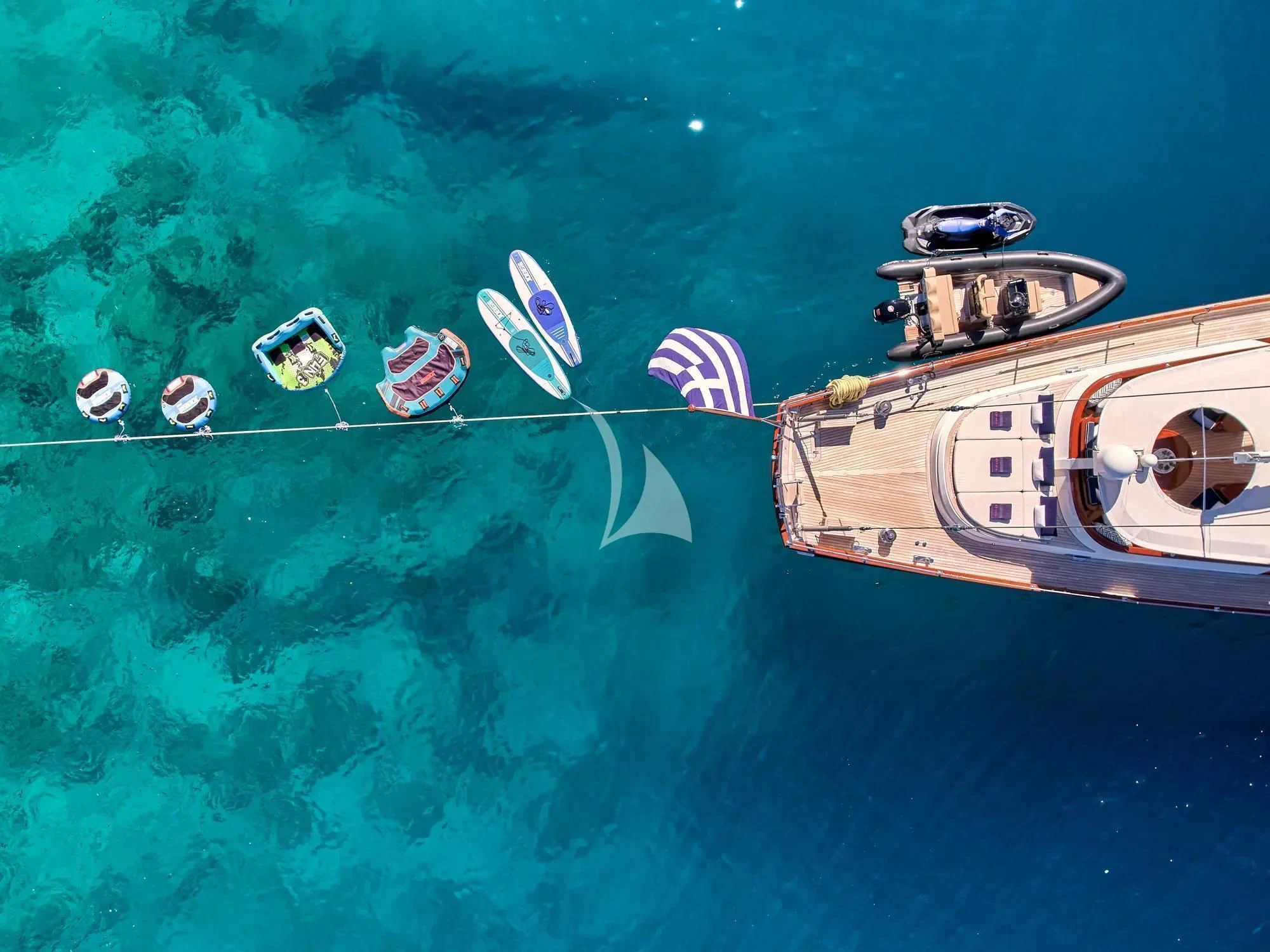 a group of boats in the water aboard GITANA Yacht for Charter