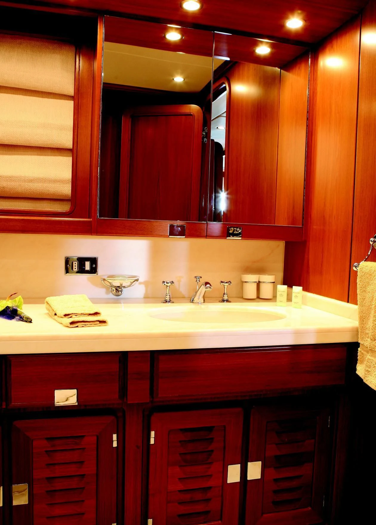 a kitchen with wooden cabinets aboard GITANA Yacht for Charter