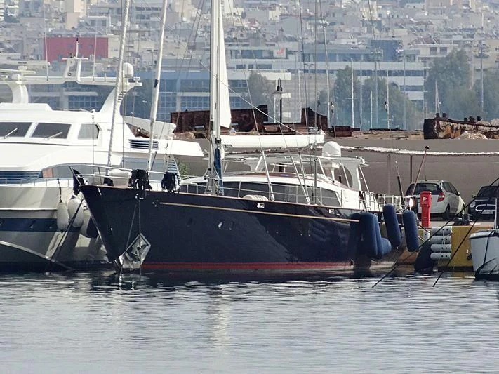 a boat docked at a port aboard GITANA Yacht for Charter