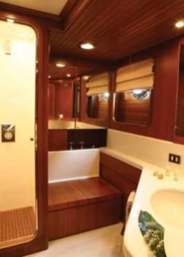 a bathroom with a tub and sink aboard GITANA Yacht for Charter