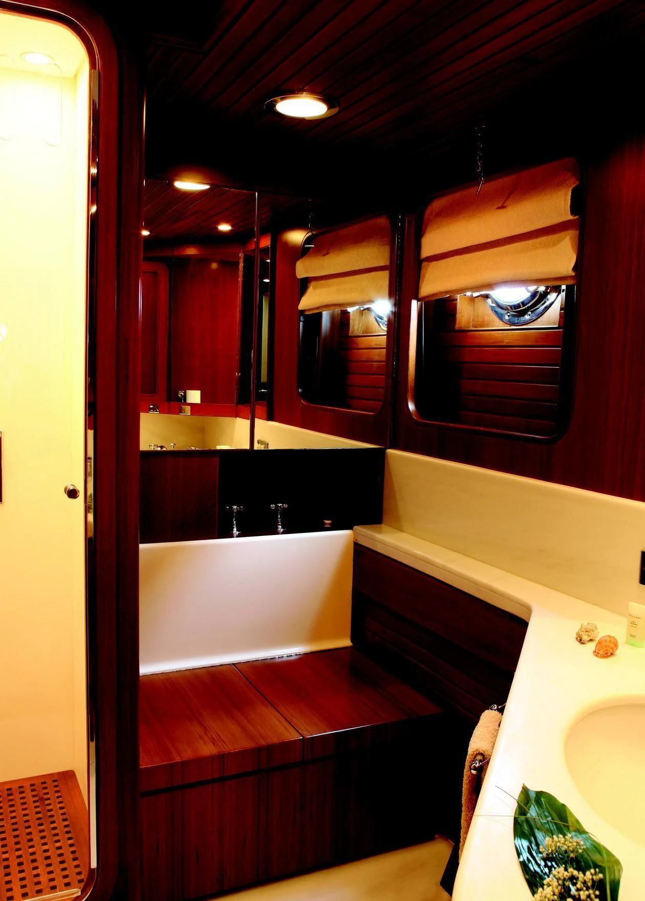 a bathroom with a tub and sink aboard GITANA Yacht for Charter