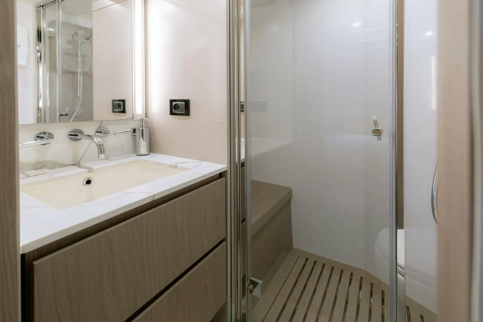 a bathroom with a glass shower aboard AZIMUT 72 Yacht for Sale
