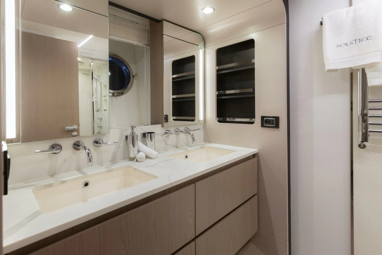 a bathroom with sinks and mirrors aboard AZIMUT 72 Yacht for Sale