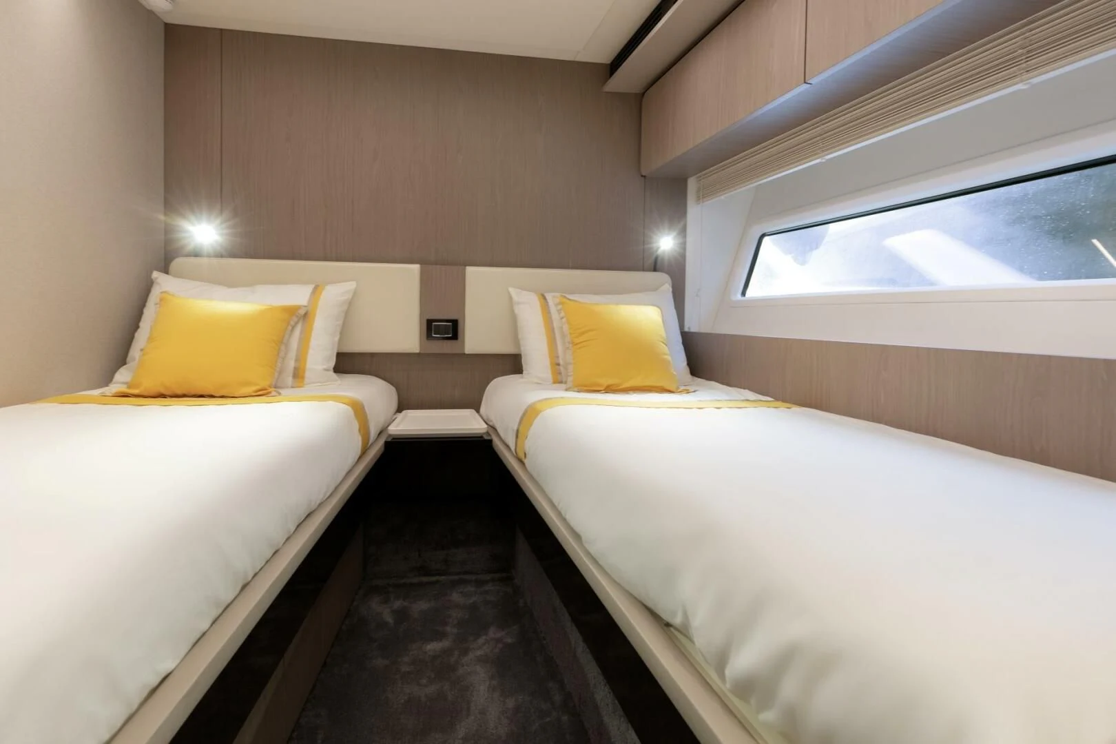 a room with beds and a window aboard AZIMUT 72 Yacht for Sale