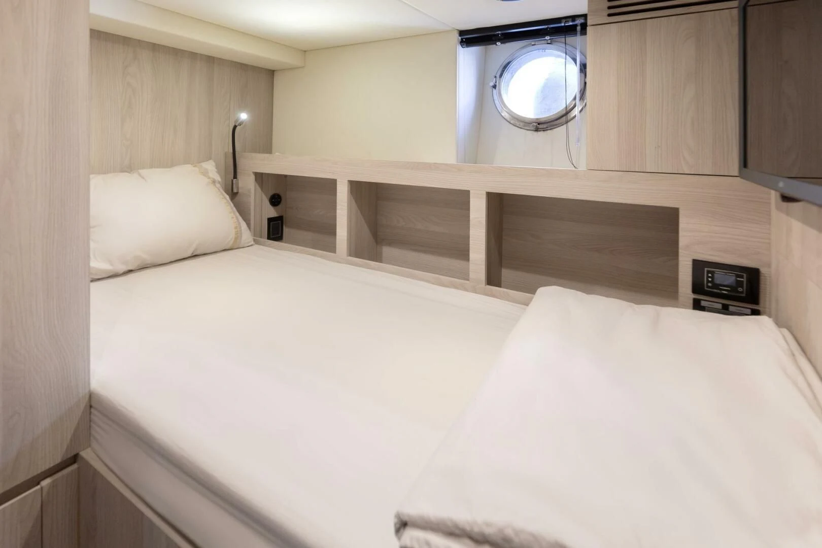 a bed with white sheets aboard AZIMUT 72 Yacht for Sale