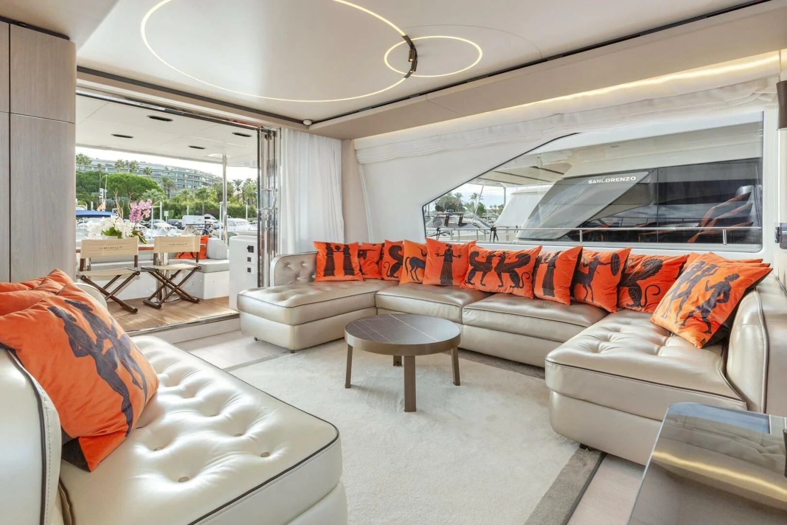 a living room with a couch and a table aboard AZIMUT 72 Yacht for Sale