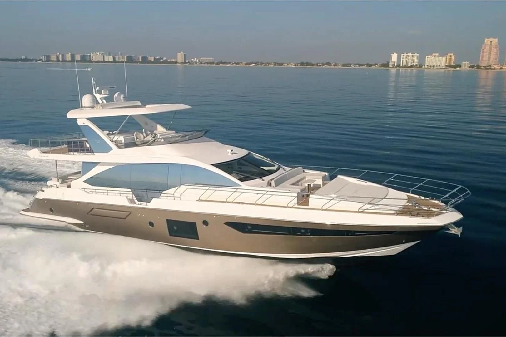 a white yacht on the water aboard AZIMUT 72 Yacht for Sale