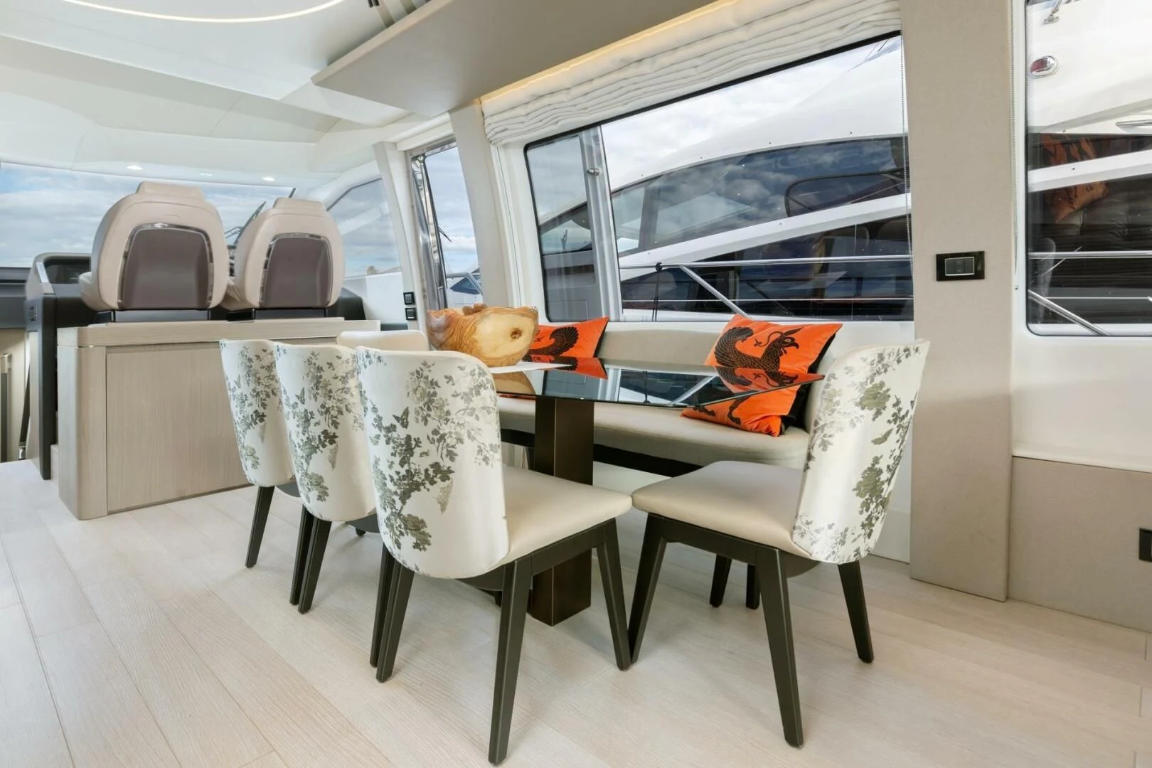 a room with chairs and a table aboard AZIMUT 72 Yacht for Sale