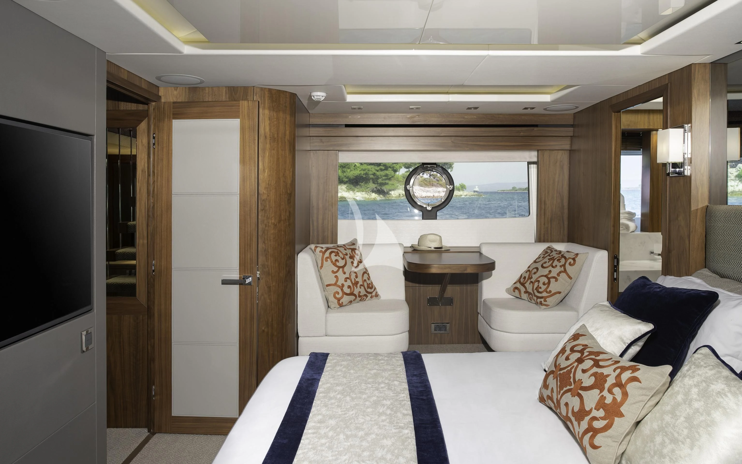 a room with a bed and a television aboard HUNKY DORY OF LONDON Yacht for Sale