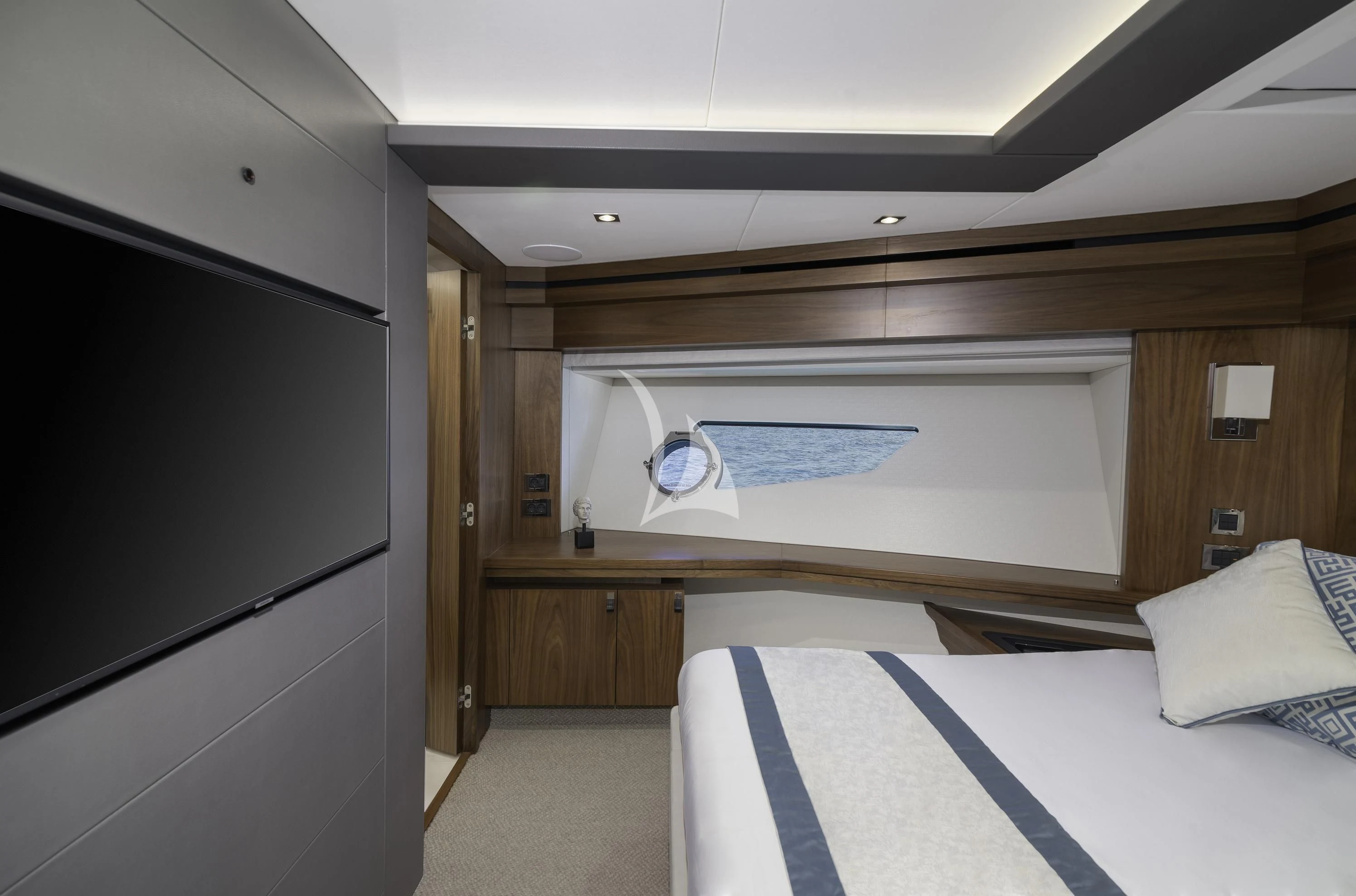 a bedroom with a bed and a television aboard HUNKY DORY OF LONDON Yacht for Sale