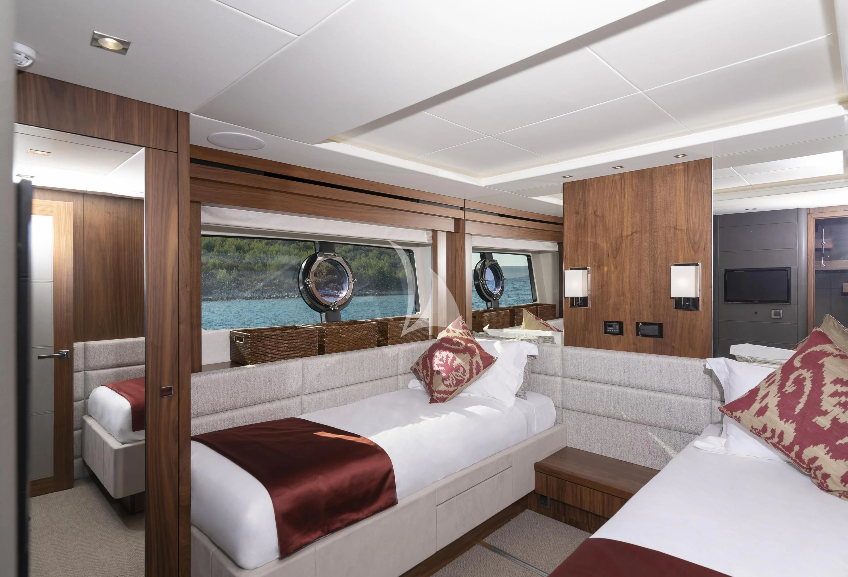 a room with a bed and a window aboard HUNKY DORY OF LONDON Yacht for Sale