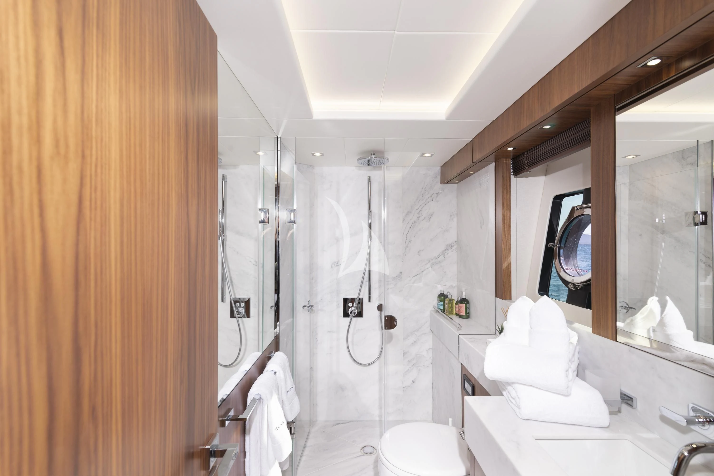 a bathroom with a shower curtain aboard HUNKY DORY OF LONDON Yacht for Sale