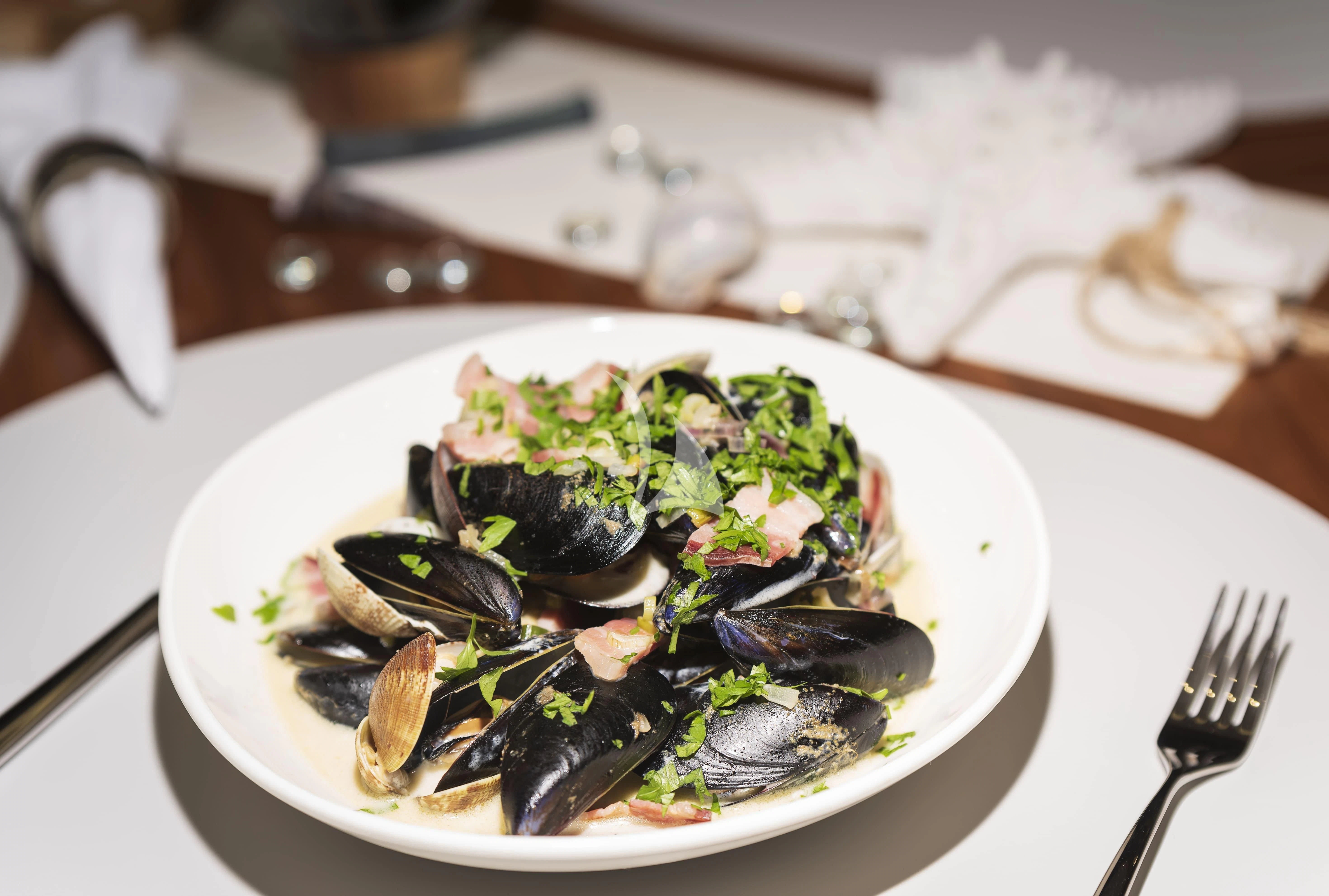 a plate of seafood aboard HUNKY DORY OF LONDON Yacht for Sale