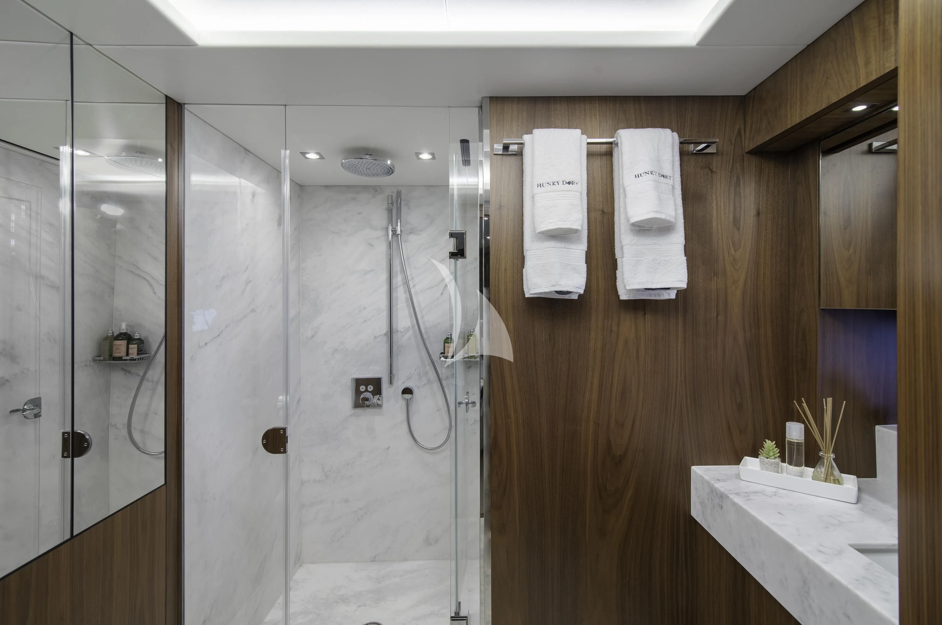a bathroom with a shower unit and sink aboard HUNKY DORY OF LONDON Yacht for Sale