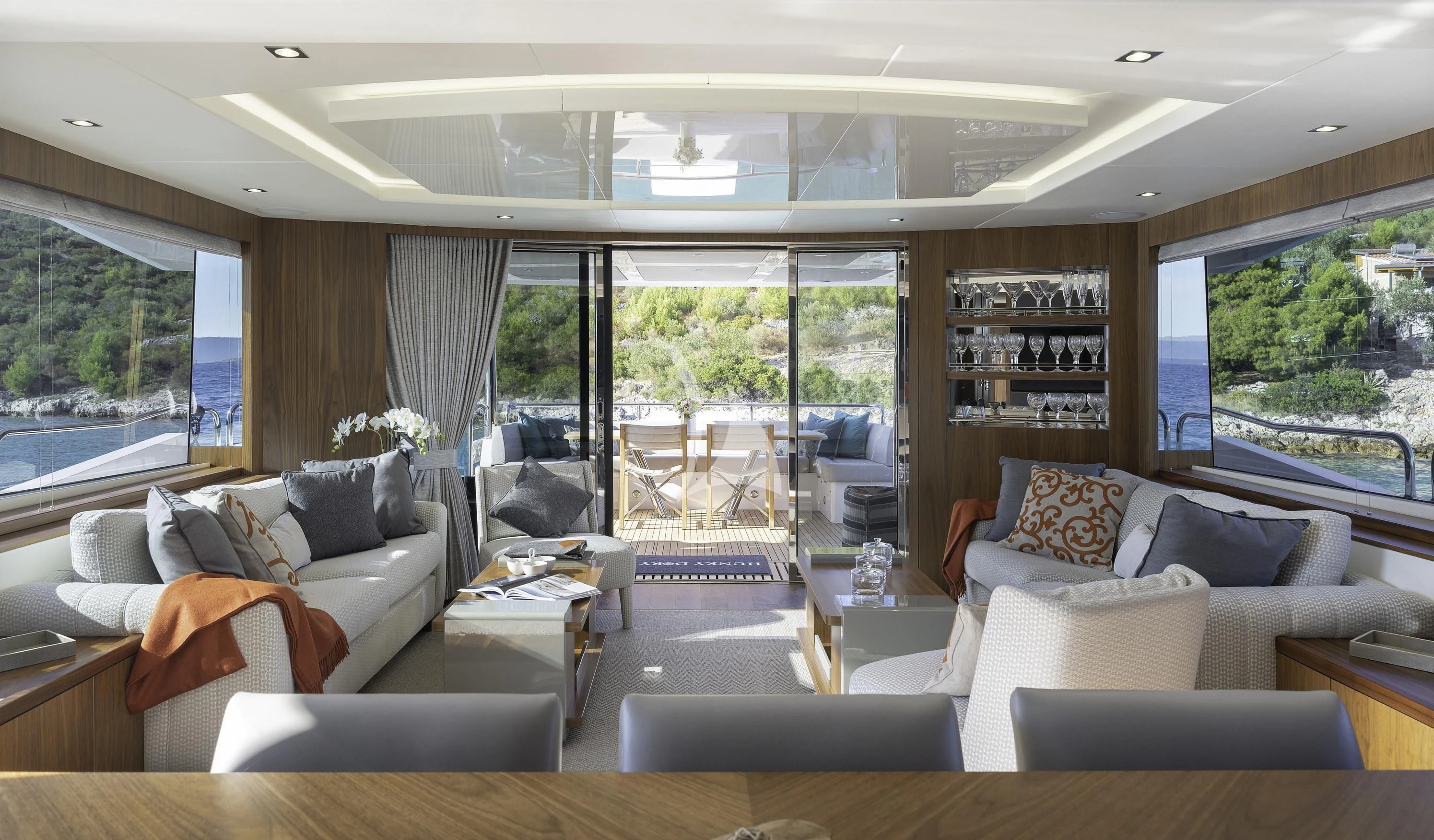 a living room with a large window aboard HUNKY DORY OF LONDON Yacht for Sale