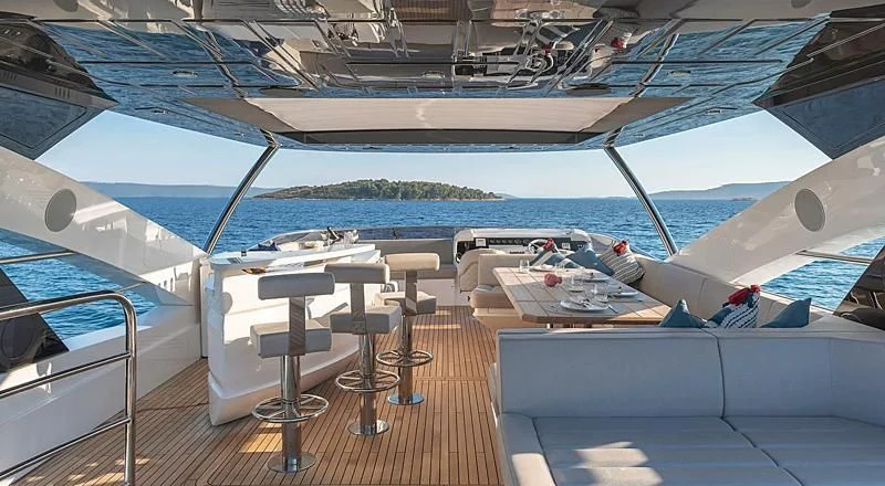 a boat with a deck and chairs aboard HUNKY DORY OF LONDON Yacht for Sale