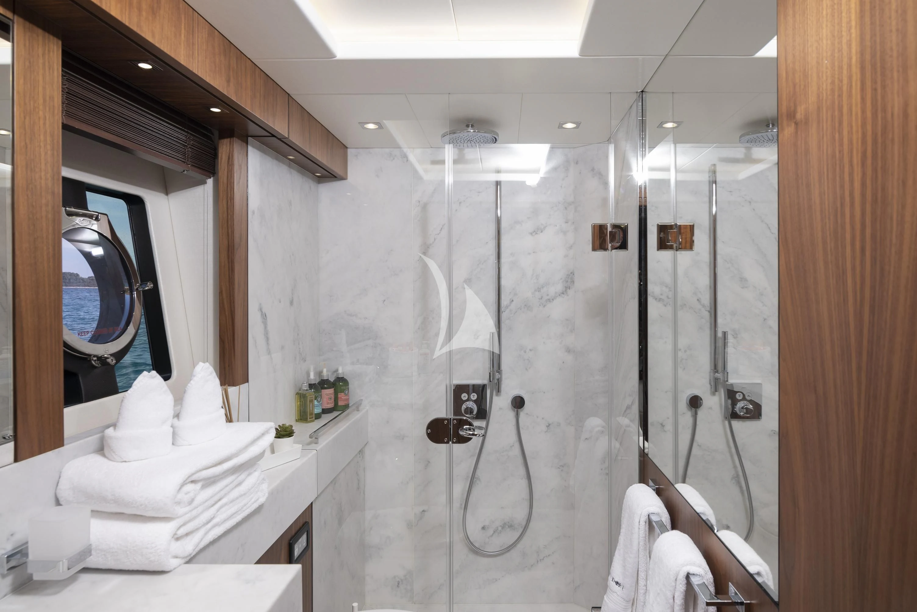 a bathroom with a large mirror aboard HUNKY DORY OF LONDON Yacht for Sale