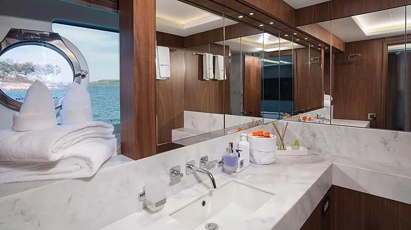 a bathroom with a large mirror aboard HUNKY DORY OF LONDON Yacht for Sale