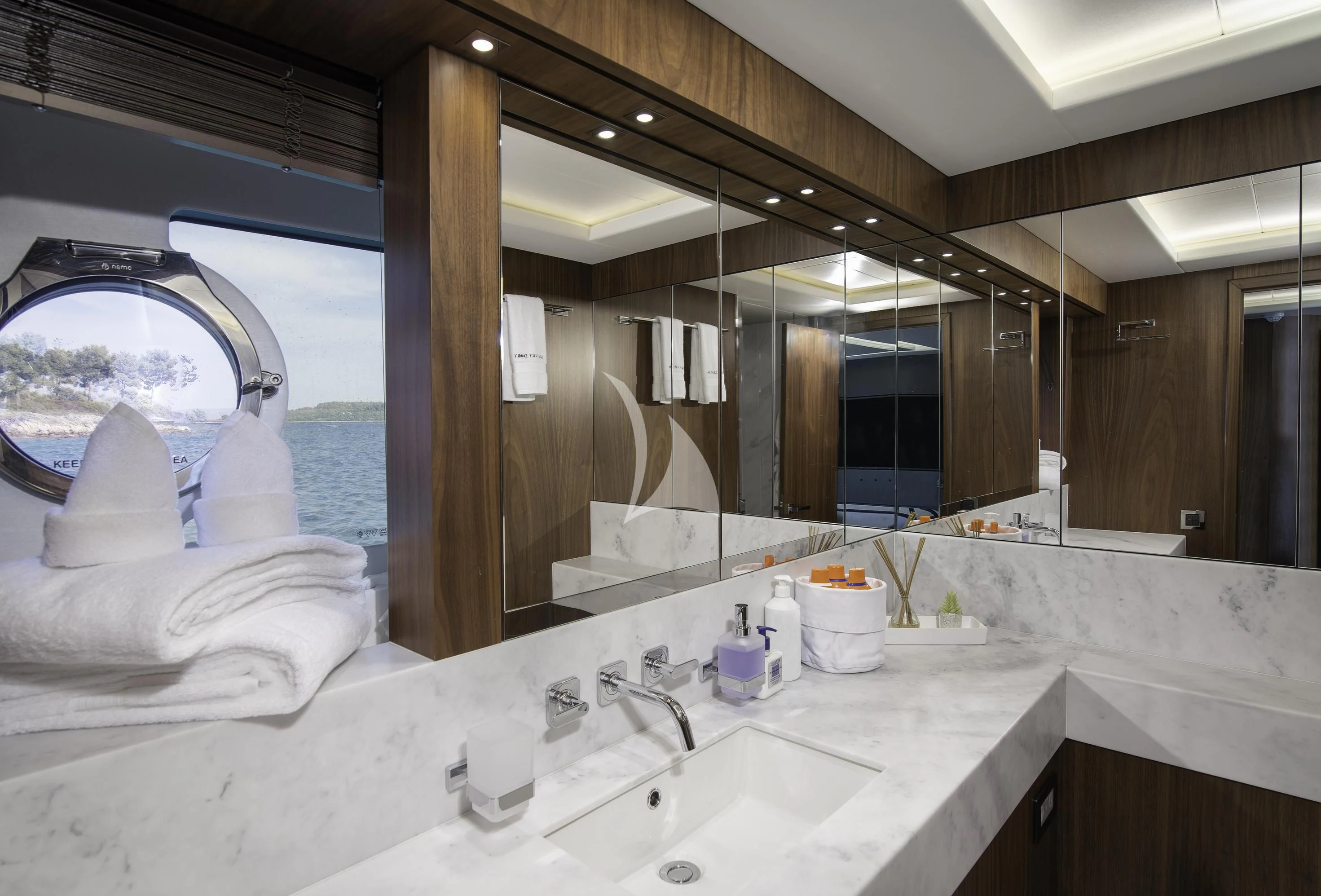 a bathroom with a large mirror aboard HUNKY DORY OF LONDON Yacht for Sale