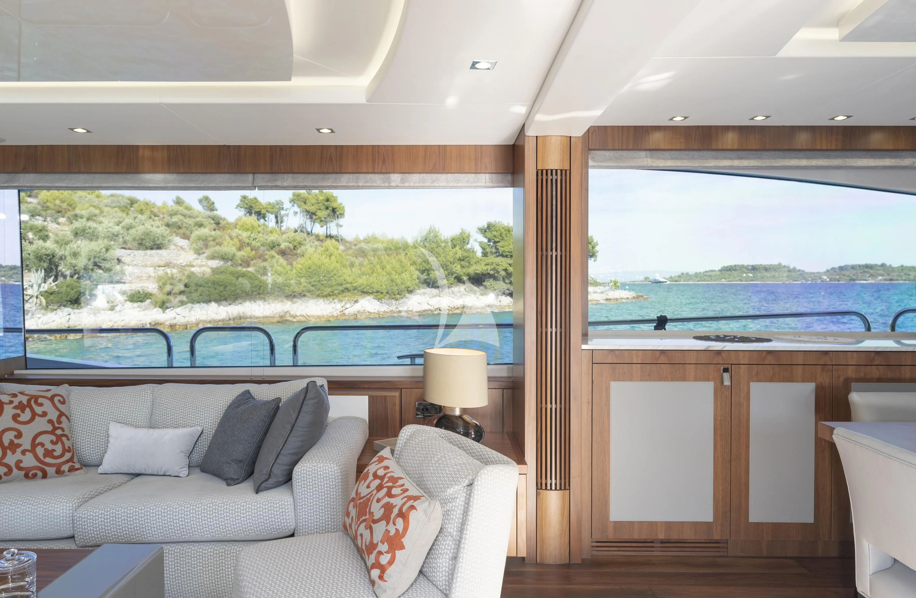 a living room with a large window aboard HUNKY DORY OF LONDON Yacht for Sale