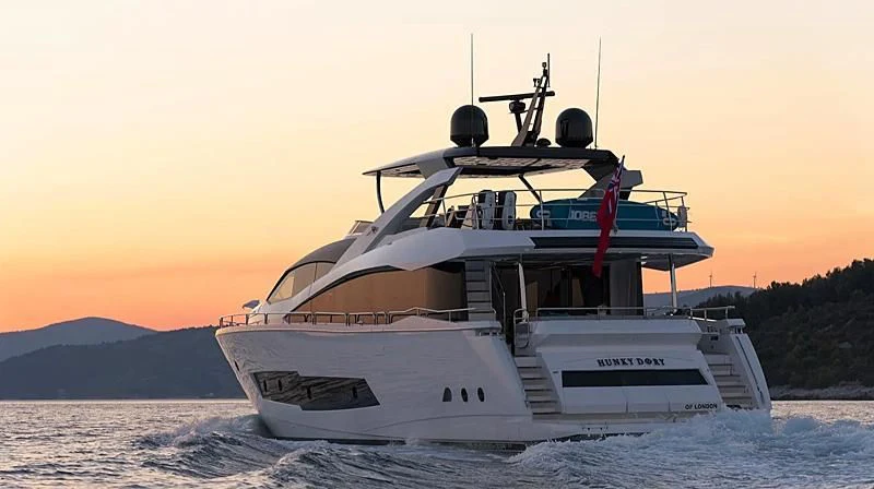 a white yacht on water aboard HUNKY DORY OF LONDON Yacht for Sale