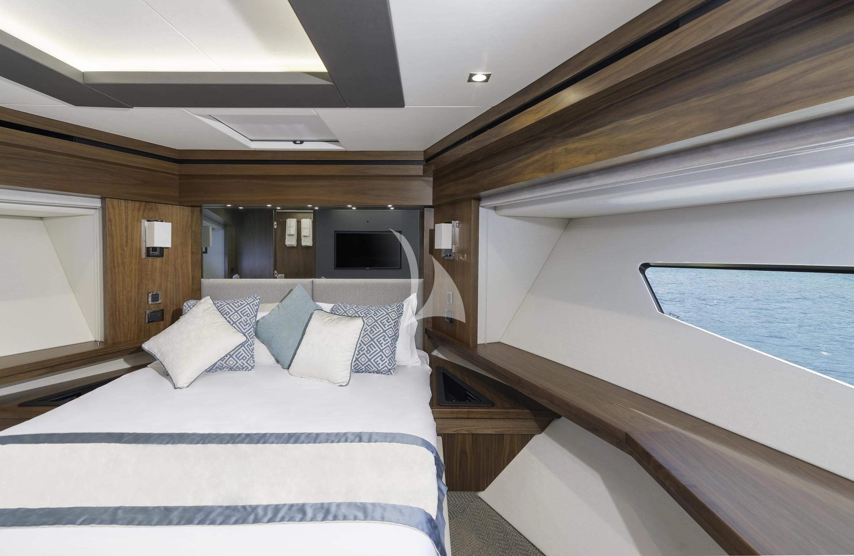 a room with a bed and a television aboard HUNKY DORY OF LONDON Yacht for Sale