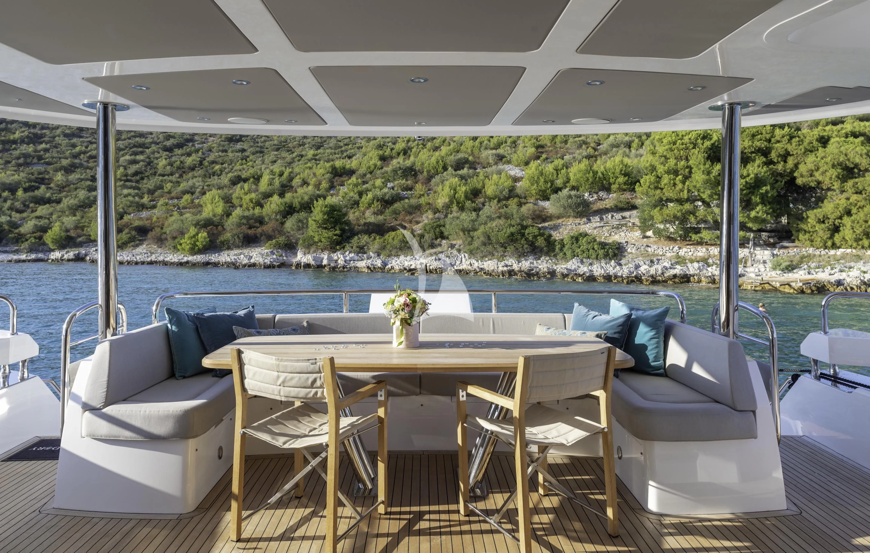 a patio with a table and chairs aboard HUNKY DORY OF LONDON Yacht for Sale
