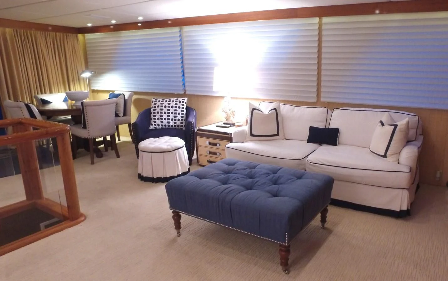 a room with a couch and a table and chairs aboard BAREFOOT V Yacht for Sale