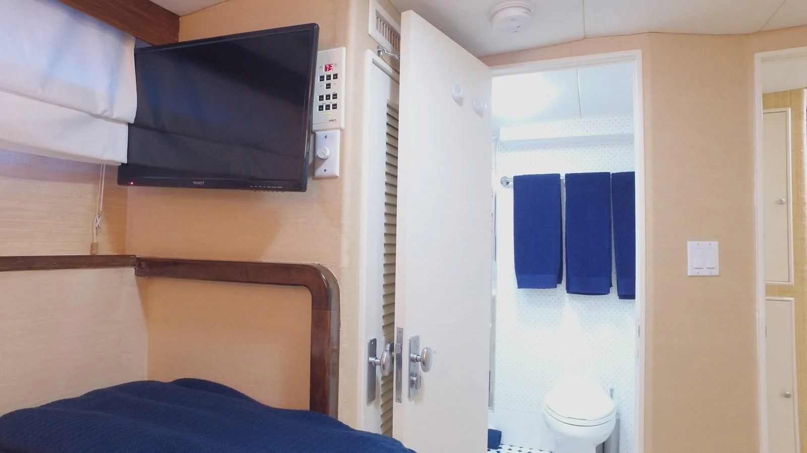 a bathroom with a blue towel aboard BAREFOOT V Yacht for Sale