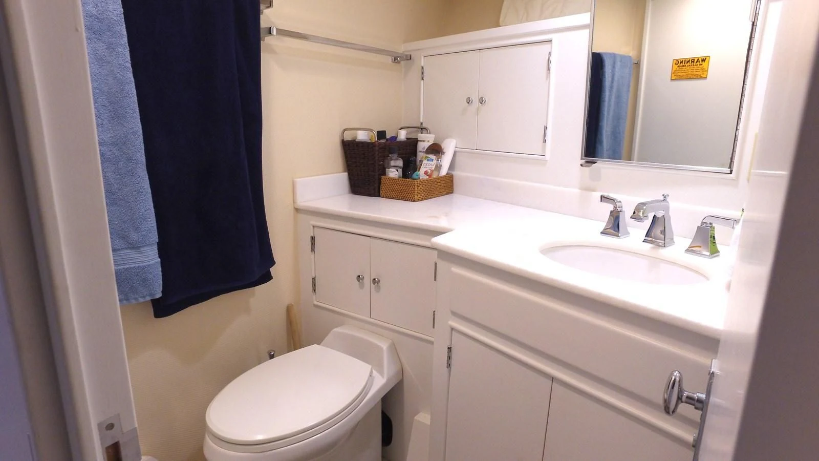 a bathroom with a sink and a toilet aboard BAREFOOT V Yacht for Sale