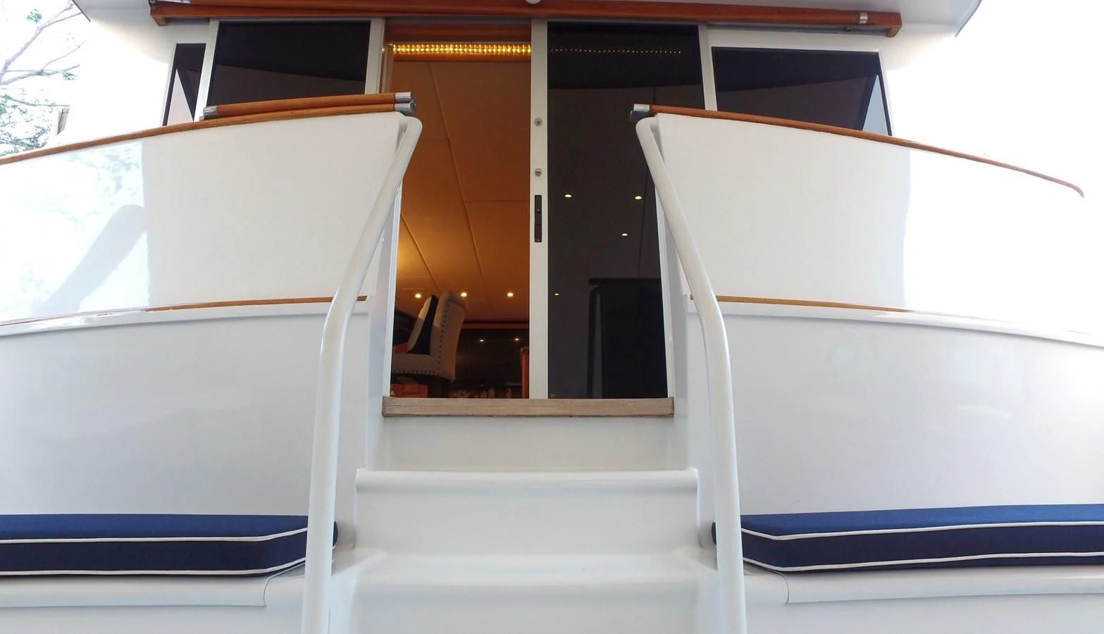 a white and black boat aboard BAREFOOT V Yacht for Sale