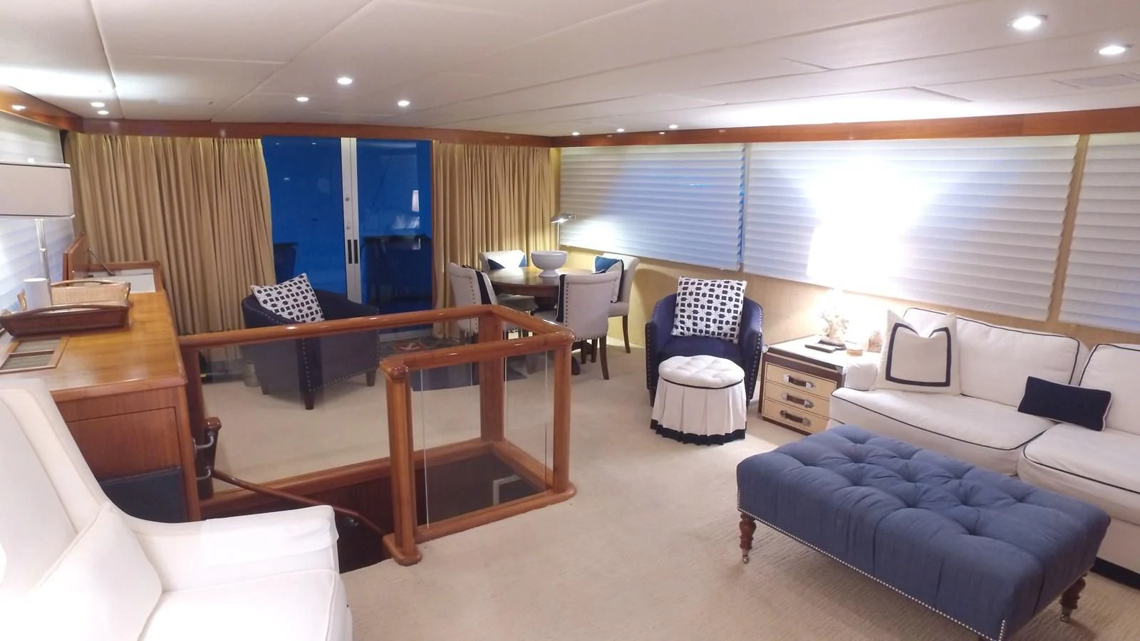 a room with a couch and a table and chairs aboard BAREFOOT V Yacht for Sale