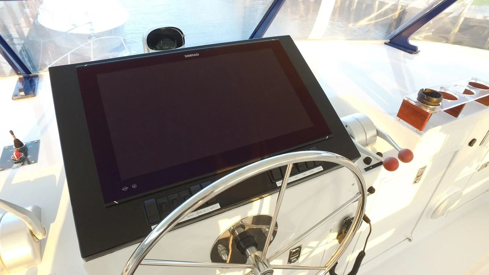 a computer on a table aboard BAREFOOT V Yacht for Sale