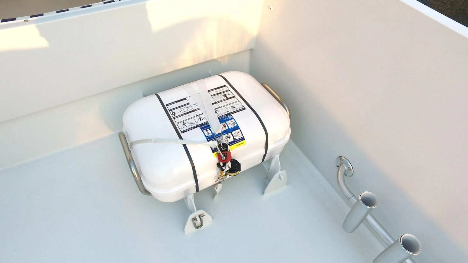 a white box with a metal handle aboard BAREFOOT V Yacht for Sale